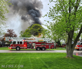 NLFD Truck 61 and Engine 64 on scene of structure fire.