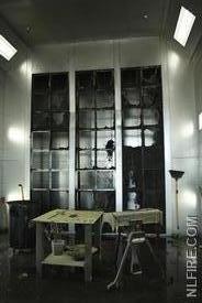Photo shows picture of paint booth after fire was extinguished. 